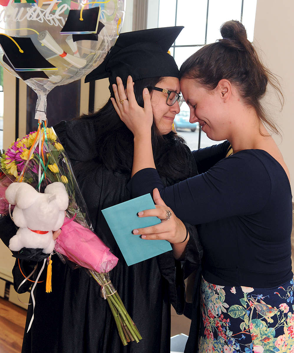 6/16/17--FRAMINGHAM-- SMOC Joan Brack Adult Learning Center High School Equivalency Test graduate and student speaker Jennifer Fernandez-Urrego is embraced by best friend Jennifer DiBenedetto following the graduation Friday.  [Daily News and Wicked Local Staff Photo/Art Illman]