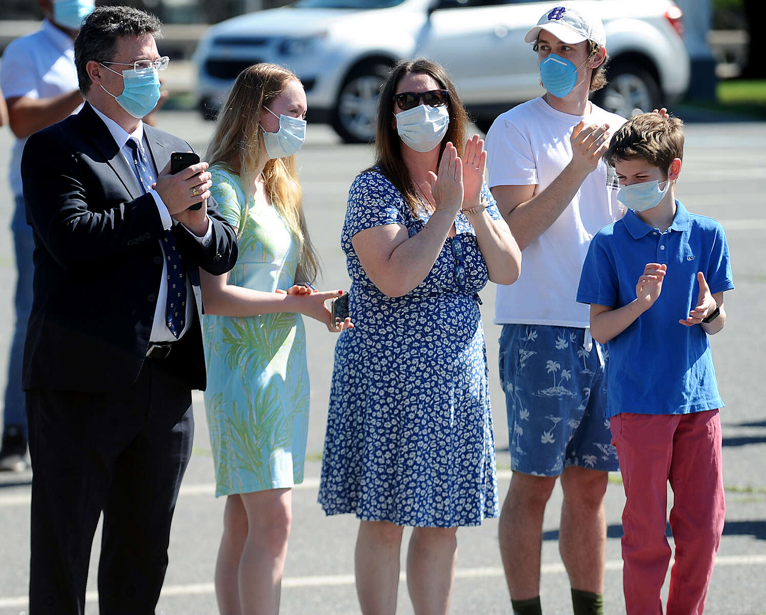 6/4/20-- FRAMINGHAM-- Applause from family members as Saint Bridget School held a physically distanced outdoor graduation for 27 eighth grade graduates Thursday morning. [Daily News and Wicked Local Staff Photo/Art Illman]
