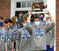 7/8/20-- HOPEDALE-- Hopedale High School boys basketball team captain Dan Liberatore hoists the co-state championship trophy outside the Draper Gym Wednesday morning. [Daily News and Wicked Local Staff Photo/Art Illman]