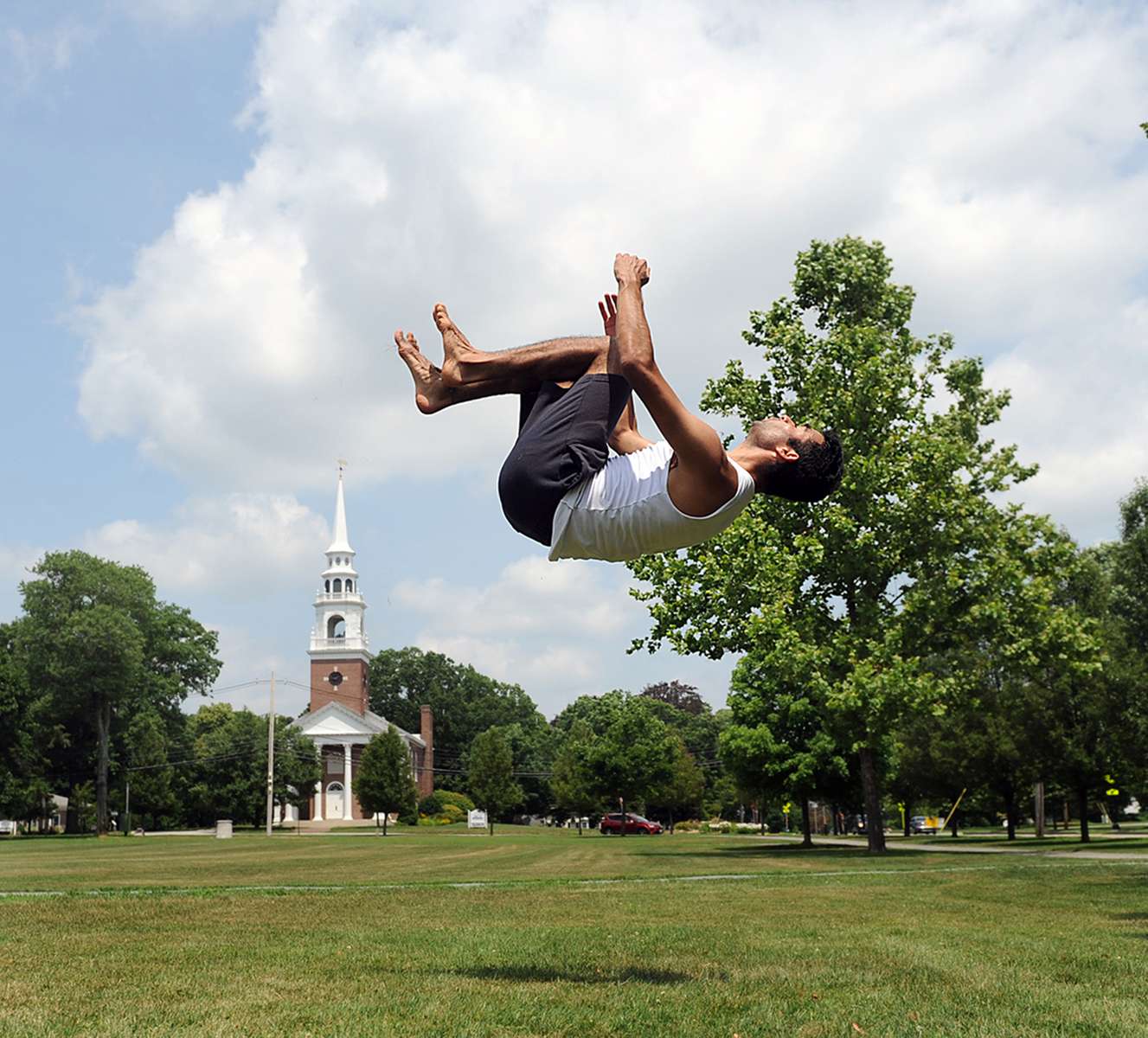 7/9/20-- FRAMINGHAM-- Ramon Martinez, of Framingham,  practices breakdancing on the Framingham Centre Village Green Thursday. [Daily News and Wicked Local Staff Photo/Art Illman]