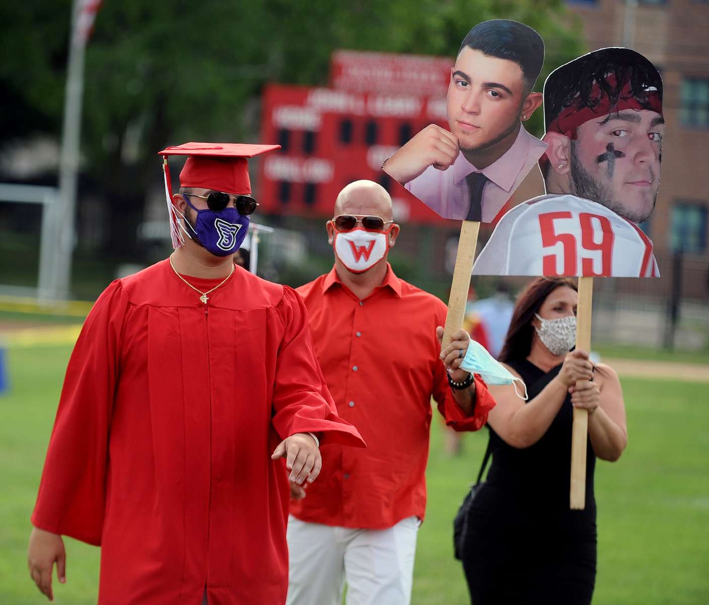 7/24/20-- WALTHAM-- Waltham High School graduate Michael DeGouff arrives at Leary Field with his parents, Rick and Pam, for a socially distanced graduation ceremony Friday evening, July 24, 2020.  [Daily News and Wicked Local Staff Photo/Art Illman]