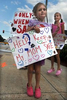 8/19/20-- MARLBOROUGH--  Bridget Fenneuff, 5, daughter of Marlborough High School math teacher Megan Fenneuff, holds signs with her mom, and sister Samantha, 8, as Marlborough teachers assembled at Union Common  Wednesday afternoon to demonstrate against going back to school.  [Daily News and Wicked Local Staff Photo/Art Illman]