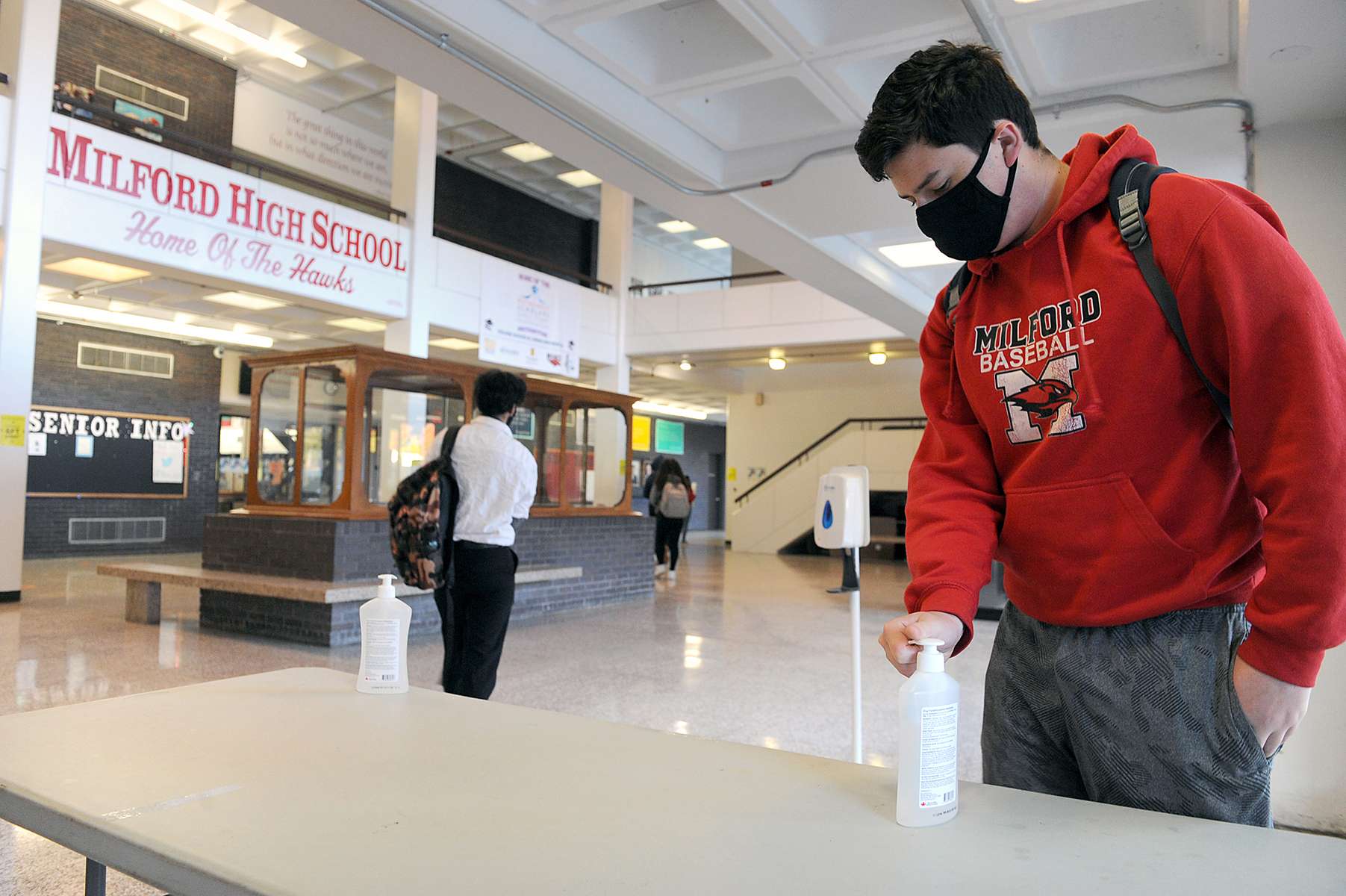 10/15/20- MILFORD - At Milford High School, students use hand sanitizer upon entering the building, and masks are provided for students who do not have one.  [Daily News and Wicked Local Staff Photo/Art Illman]