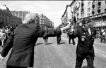 John P. {quote}Jake{quote} Comer, of Quincy, Past National Commander of the American Legion, takes a flower from a Russian citizen during the Victory Day Parade in Moscow in 1990. [Daily News and Wicked Local Staff Photo/Art Illman]
