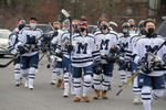 The Medway High  School hockey team marches through the parking lot to Pirelli Veterans Arena in Franklin, Jan. 6, 2021. The locker rooms are closed due to the COVID-19 pandemic. Medway played its season opener against Bellingham.