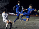 Ashland High School soccer player Shea Donovan goes airborne against Norton Nov. 13, 2020.