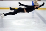 Athena Boulas, of Framingham, who competes at the U.S. Figure Skating Senior Lady Level for the Center Skating Academy at the New England Sports Center,  in Marlborough,  goes airborn during a butterfly spin, Feb. 7, 2022. 