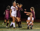 Algonquin Regional High School senior Gabby Miranda, center, after scoring the game winning goal in sudden death overtime against Wellesley, at Walpole High School, Nov. 16, 2022. The Titans advance to the Div. 1 state girls soccer finals. 