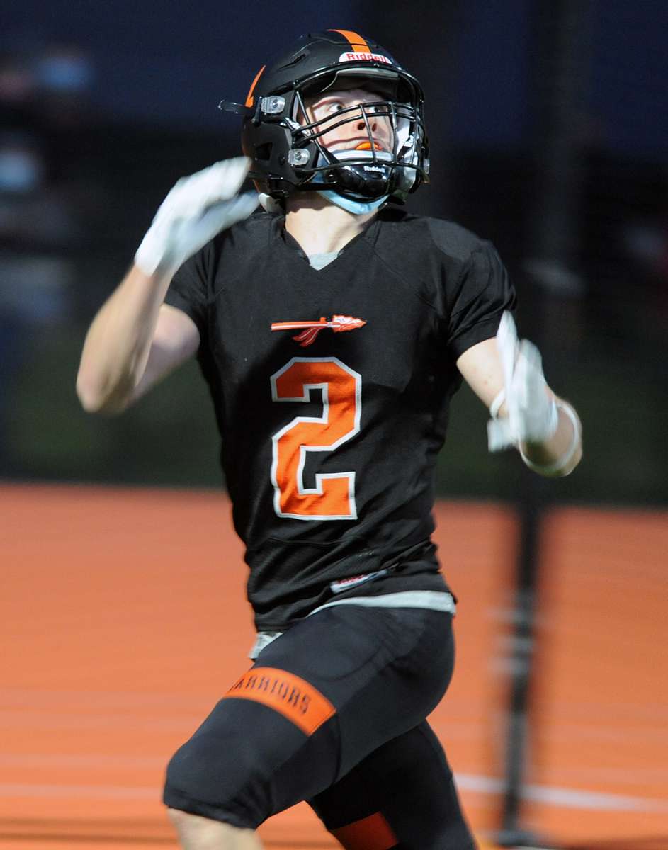 Wayland High School Football senior William Carr locks in on a passduring the 39-36 comeback win against Holliston, April 23, 2021.