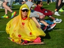 Giovanni Galati, from Rome, Italy, soaks up early sunshine at the Athlete's Village at Hopkinton High School  before the 128th running of the Boston Marathon, April 15, 2024.