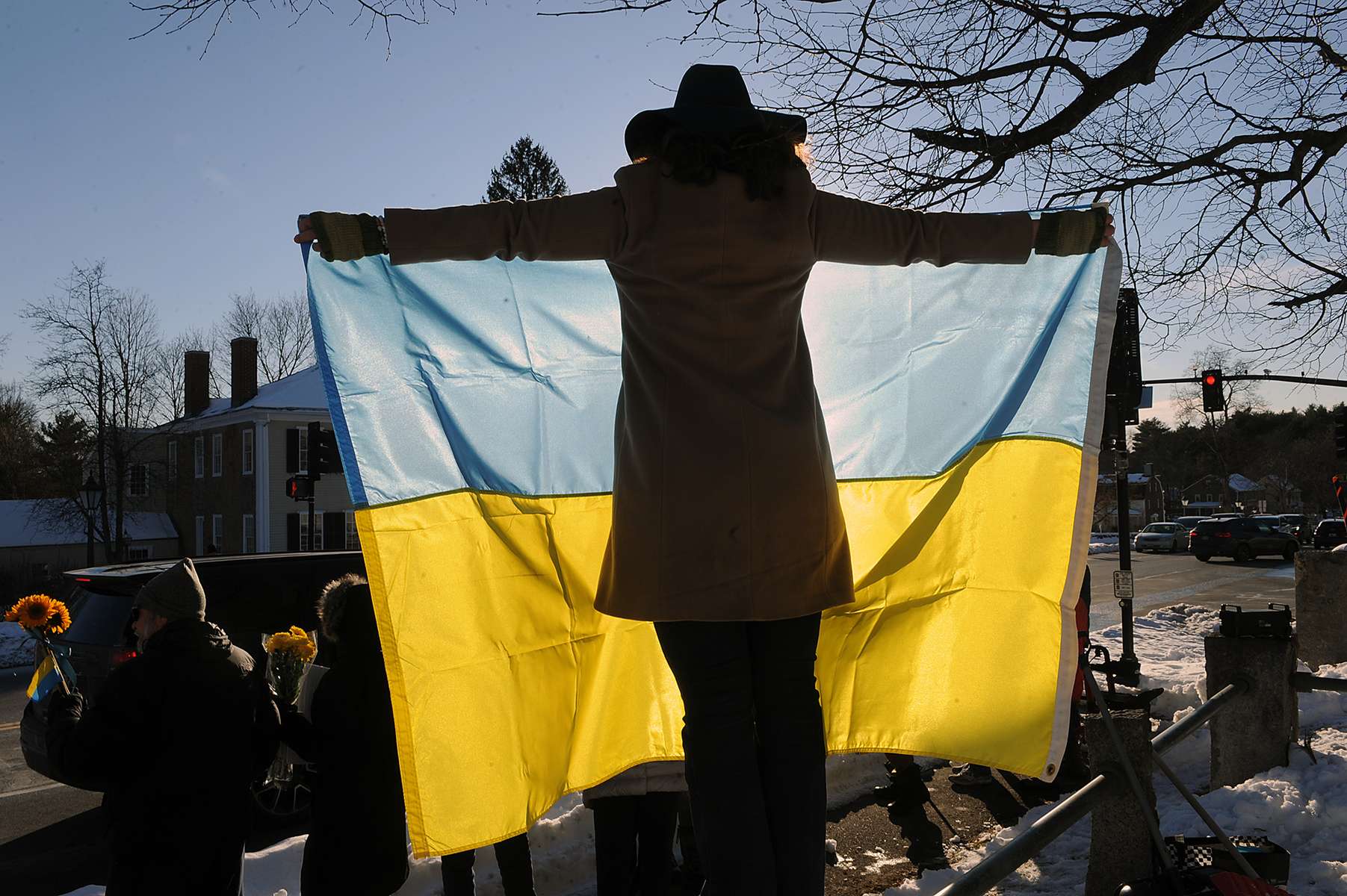 At a rally supporting Ukraine on Sudbury Common, organized by Sudbury Stands for Democracy, Vira Slywotzky, of New York City, holds the Ukrainian flag,  Feb. 28, 2022. 