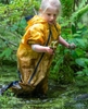At the Framingham Centre Nursery School, 5-year-old Laelah Smethurst, known as the frog queen among her peers in the Chipmunk class, emerges from the pond with a frog in each hand, June 8, 2023.  The nature-based program at the nursery school has students outside 90 eprcent of the time.  {quote}They learn about science., said director Jacey Norton. {quote}We want the kids to be naturalists, to learn that all  animals have purpose.  They learn how to identify poison ivy. They learn how to be safe in the woods. Outdoor education teaches social and emotional skills, balance and core strength,{quote} Norton said.