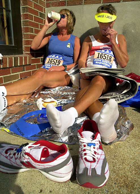 Relaxing pre race in 2004, winner of women visually impaired division for the past seven years, Paula Lamkin, of Jacksonville, FL, left; and her guide, husband Charlie, who was starting his 24th consecutive Boston Marathon.