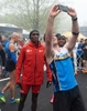 A runner from Team Hoyt San Diego  takes a selfie with elite runner Eliud Kipchoge prior to the running of the 127th Boston Mararthon, April 17, 2023.