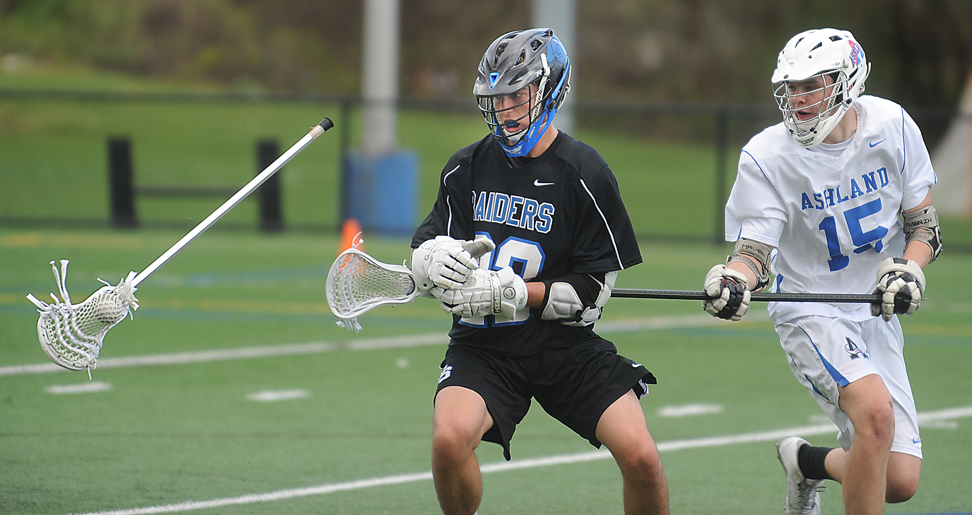 5/2/17-- ASHLAND- Ashland's C. Dunn slashes the stick with ball in tact out of the gloves of Dover Sherborn's Jack Dillon Tuesday. [Daily News and Wicked Local Staff Photo/Art Illman]