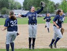 6/4/14-- FRAMINGHAM--  Framingham Capt. Marisa Sanchez celebrates after catching the final out in a 3-0 playoff victory over Boston Latin Wednesday.Daily News Staff Photo/Art Illman