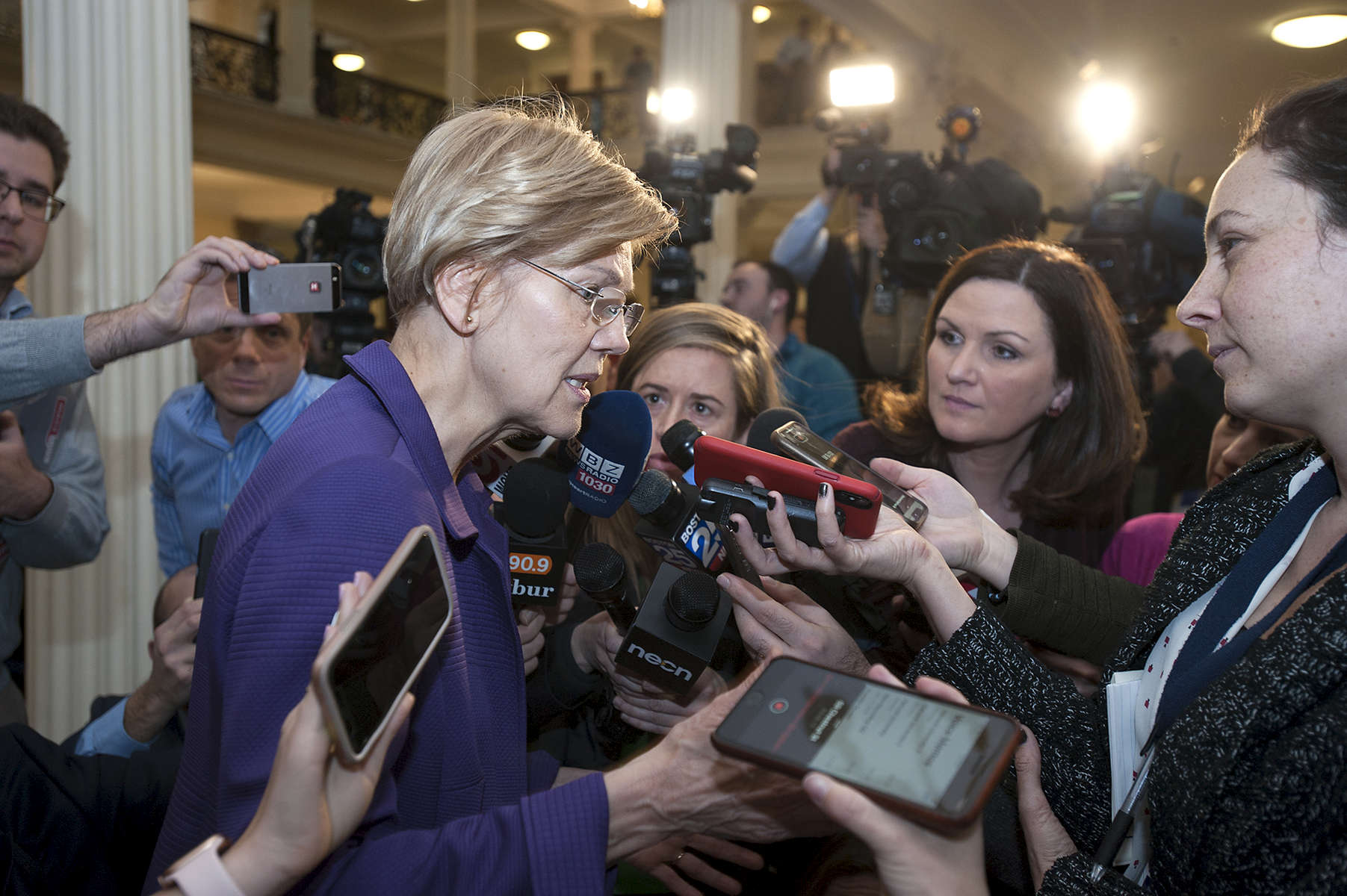 1/2/19-- BOSTON--  Senator Elizabeth Warren surrounded by the Boston media after legislators were sworn in at the Senate chambers Wednesday. She announced an exploratory committee to run for President. [Daily News and Wicked Local Staff Photo/Art Illman]