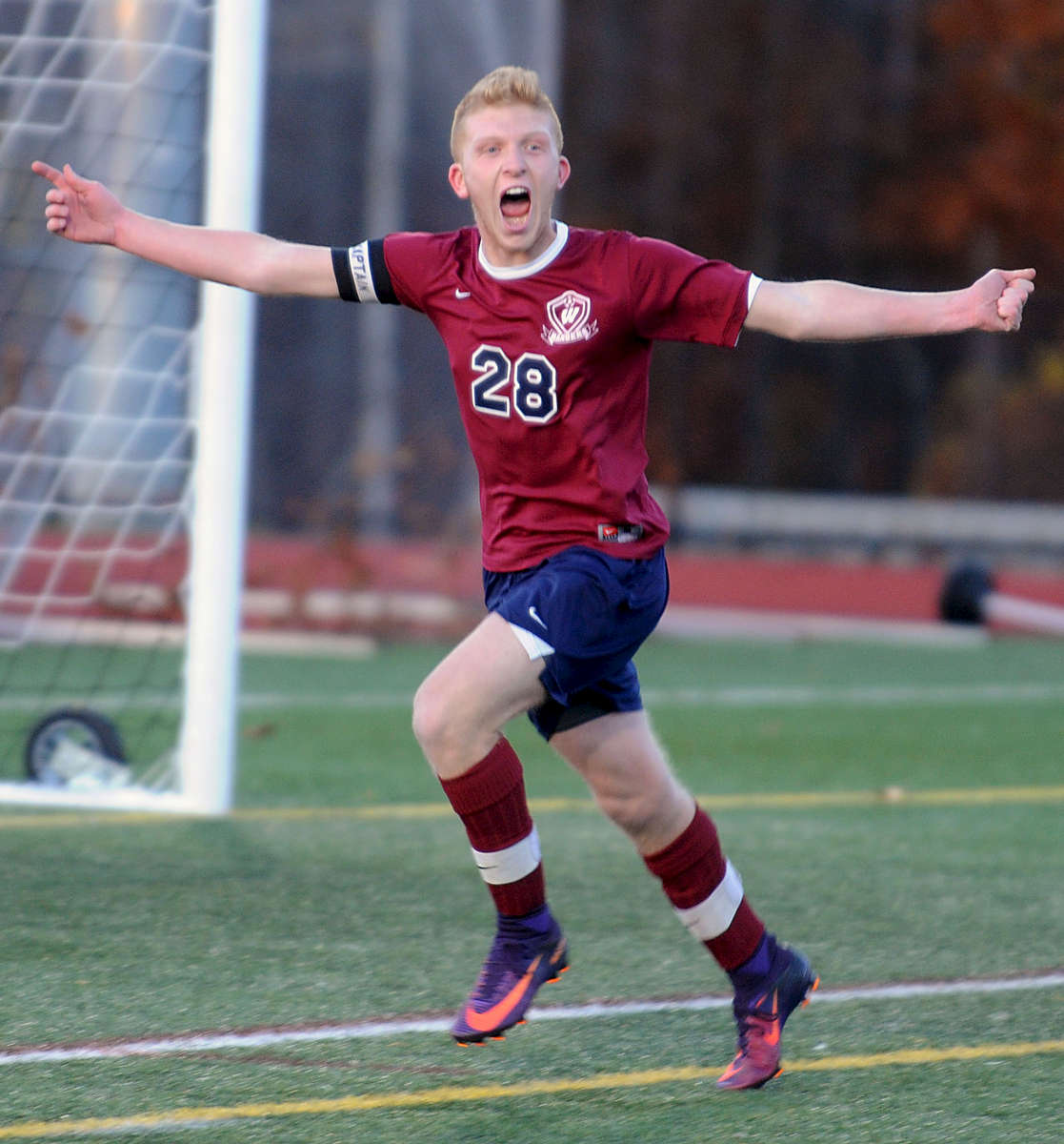 11/11/16-- BOLTON-- Westborough senior captain Spencer Nagi celebrates after scoring a penalty kick in overtime to defeat Wachusett, 2-1,  to clinch the Div. 1 Central title at Nashoba Regional High School Friday afternoon.Daily News and Wicked Local Staff Photo/Art Illman