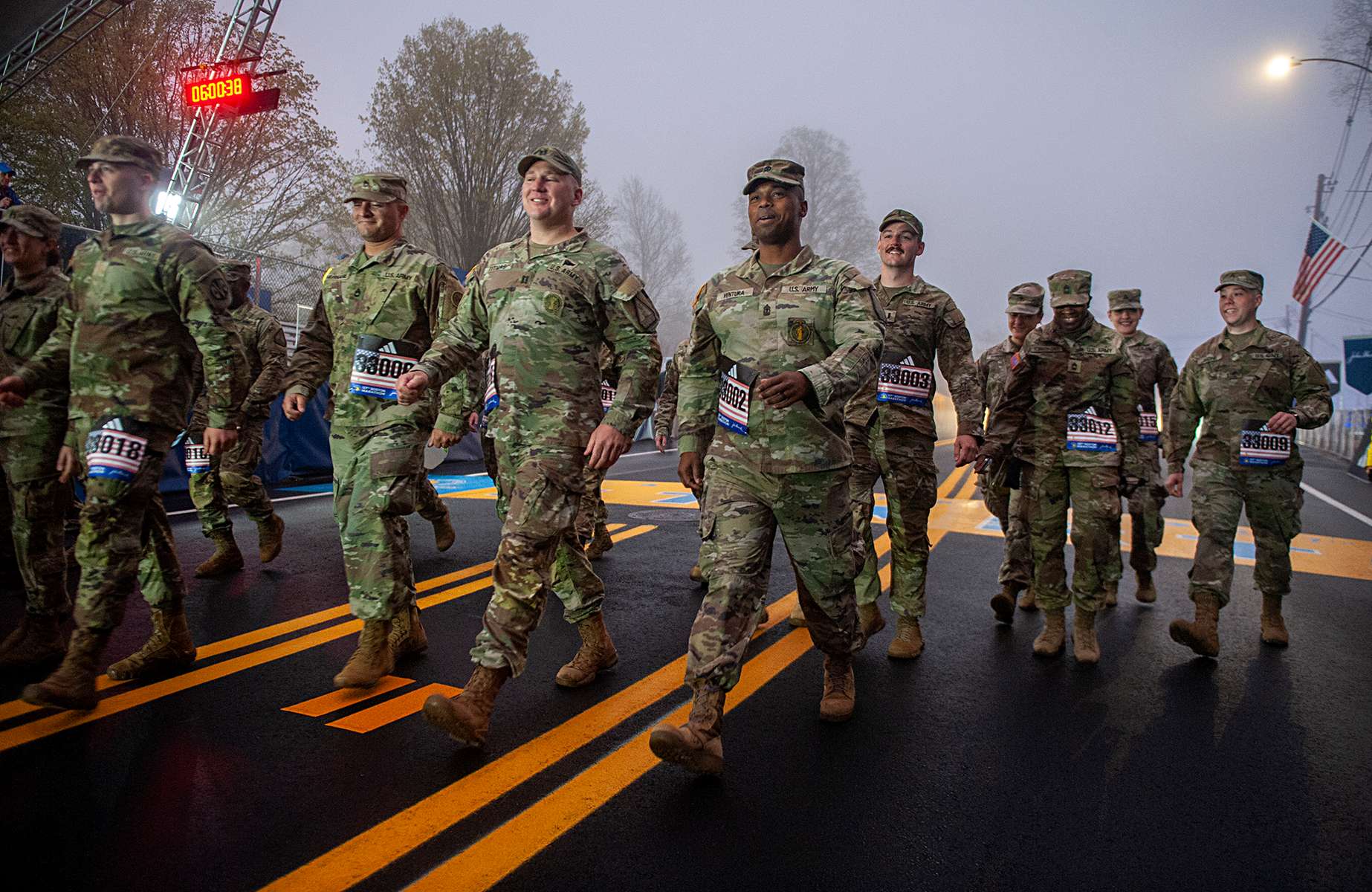 Twenty-two soldiers from the Mass. National Guard began their 26.3 mile march at 6 am to kick off the Boston Marathon in Hopkinton, April 17, 2023.