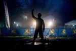 The starter statue in silhouette the morning of the 127th running of the Boston Marathon in Hopkinton, April 17, 2023.