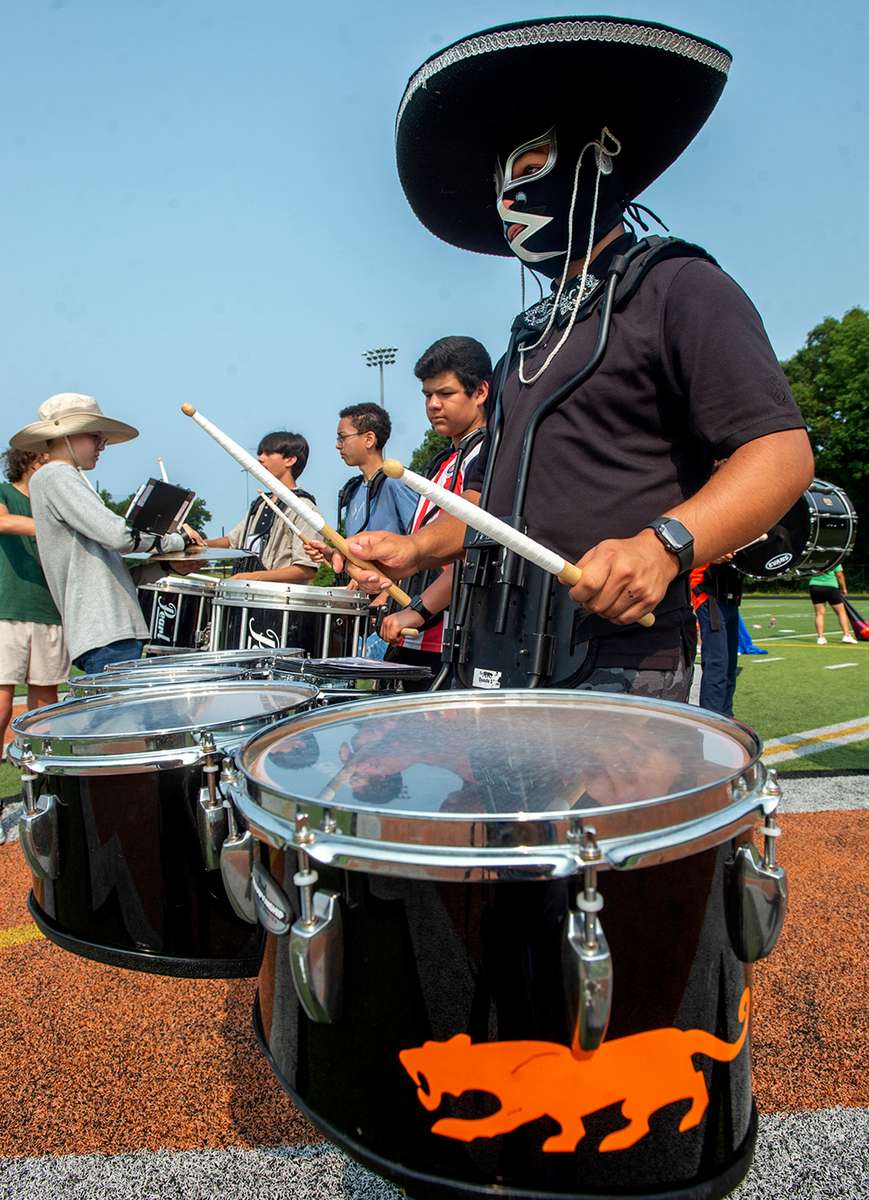 Marlborough Marching Panther Band Drumline Director PJ Alcantar, wearing a luchador mask andmariachi hat, at band camp at the Whitcomb Middle School Field, Aug. 15, 2024. The band will perform at the Marlborough Labor Day Parade Sept. 2, and at the first football game at Kelleher Field, Sept 6.