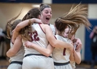 Millis High School captain Mia Molinari, center, jumps for joy with teammates after defeating Hoosac Valley, 57-47, at the  Springfield High School of Science and Technology, March 15, 2023.  The Mohawks will play in the Div. 5 state finals this weekend.