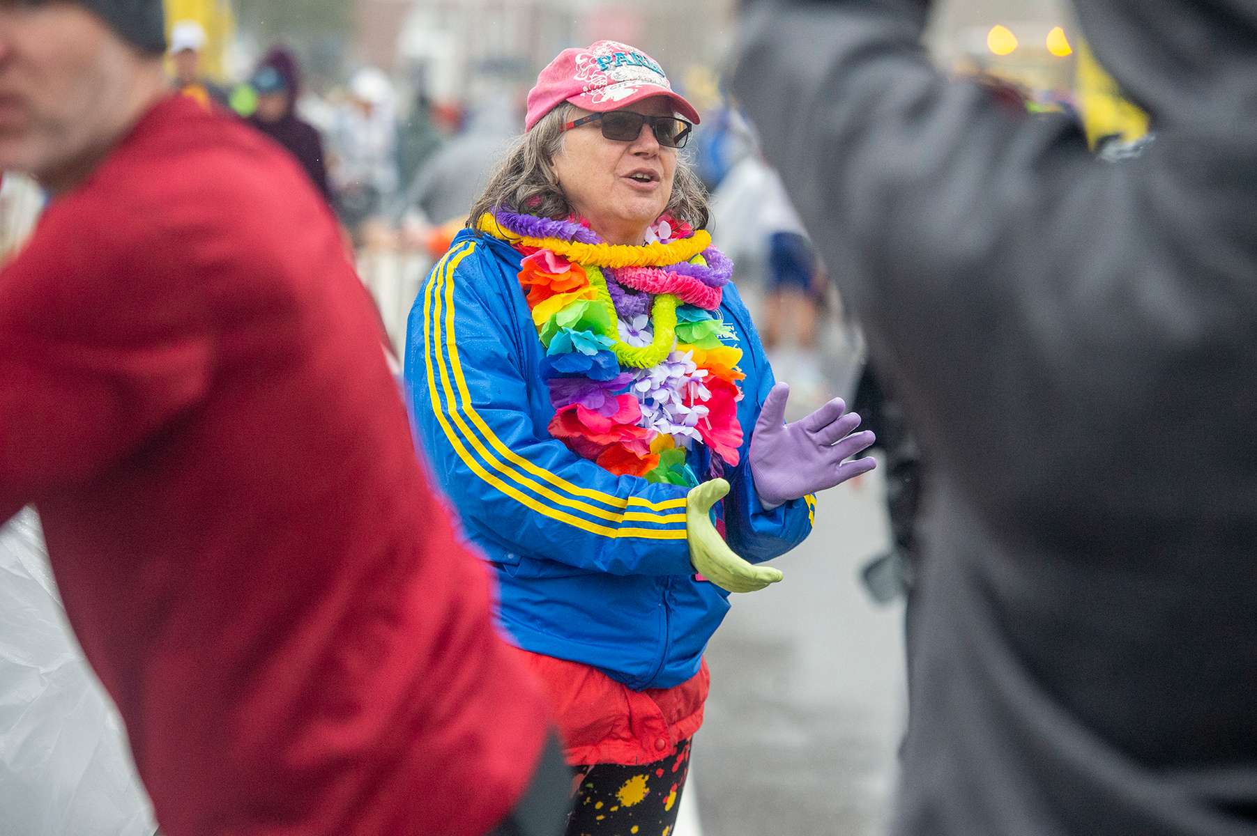 Kathy Pauley, of New Hampshire, cheers on runners walking to their corrals at the 127th running of the Boston Marathon in Hopkinton, April 17, 2023.