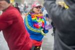 Kathy Pauley, of New Hampshire, cheers on runners walking to their corrals at the 127th running of the Boston Marathon in Hopkinton, April 17, 2023.