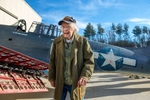 101-year-old WWII veteran Russell Phipps, of Hopkinton, at the  American Heritage Museum  in Hudson, and an SBD Dauntless aircraft, the primary carrier based dive bomber used by the U.S. Navy during WWII, Dec. 29, 2022.