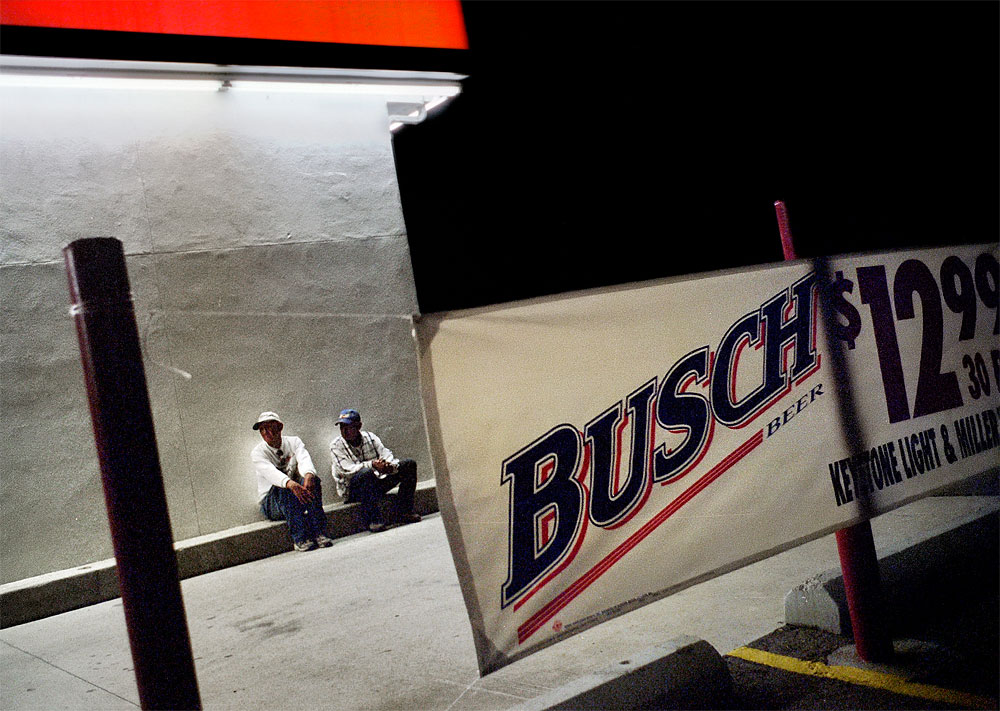 Outside the Mustang gas station, formerly the {quote}My Place{quote} bar, Paul, left, and Ben wait for a willing customer to buy them more beer on a Friday night. Still drunk, the two made their way across the four lanes of State Route 64 and past Zia Liquors to walk home in Fruitland, N.M.