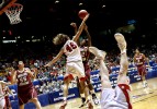 Boston College's Brittanny Johnson, center, has a shot blocked by Utah's Jessica Perry. Kim Smith of Utah, foreground, was turned upside down during the play. Utah won the third round 2006 NCAA tournament game at The Pit 57-54.