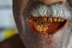 The result of chewing betel nut, mustard and lime.  © Brian Cassey