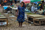 A woman chewing betel nut leaves Hohola market, Port Moresby.  © Brian Cassey