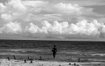 A man looks out to sea worried that another wave is coming.© Sam Mooy 2007 for The Australian