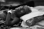 An injured elderly man  from the island of Gizo waits to be treated at a makeshift hospital.© Sam Mooy 2007 for The Australian