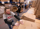 JOINT BASE CAPE COD - Catherine Sutton, strike team leader for disaster response NGO, Team Rubicon, put together boxes that will contain a 14-day supply of food for veterans and their families on Thursday, April 2, 2020. This Food4Vets is organized by the Massachusetts and Cape Cod Military Support Foundations and has a goal of distributing 50,000 boxes. 