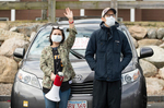 HYANNIS - Organizer Inna Taylor, youth director at Grace Church, and her husband Andrew Taylor wave to healthcare works from the Cape Cod Hospital parking lot on Friday, April 10, 2020. 