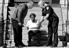 Police speak to Rosa Ball who was arrested at the Friendly House Shelter, 87 Elm Street, in connection with stabbing in front of the former PIP shelter on Main Street on Wednesday, April 15, 2015. She was charged with armed assault with intent to murder and assault and battery with a dangerous weapon 