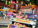 Neighbors Kaitlyn Riley, 11, and Emma Itri, 7, both of Bourne scream as they ride the Scrambler at the Barnstable County Fair on opening day at Cape Cod Fairgrounds.