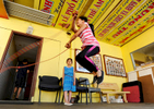 Malaney Nguyen, 10, jumps rope as Vianna Ha, 7, observes during the Nhu Thanh Youth Group program at Phổ Hiền Buddhist Temple on Thursday, May 7, 2015. 