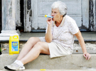Carol Pfeiffer blows bubbles for her grandchildren in front of her house on Thursday, May 28, 2015. T&G Staff/Christine Hochkeppel