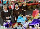 From left, Sisters Jeanne Marie Akalski, Mary Valenta Akalski and Mary Ann Papiez of St. Joseph's Basilica place their raffle tickets on the prizes that interest them at the St. Andrew Bobola Church Festival on Saturday, August 29, 2015. 