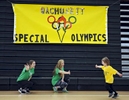Jacob Reando, 5, of Paxton collects high fives from Wachusett High School freshman Maddie Wilde, 15, and junior Alexis Bergman, 17, far left, during the 3rd annual Wachusett Special Olympics on Thursday, March 17, 2016. T&G Staff/Christine Hochkeppel