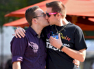 Johnny Sacs of Douglas and Timothy Gustafson of Dudley share a kiss during the Pride Festival on the Worcester Common on Saturday, September 10, 2016. 