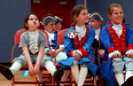 Martin Elementary School third grader Rachel Tinley (left) oohs along to {quote}Where do I Sign?{quote} in her class' American Revolution musical performance on Tuesday, June 13, 2006.