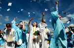 The Seekonk High School graduating class of 2007 tosses their caps into the sky at the closing of commencement on Sunday, June 18, 2007.  