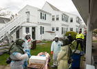 HYANNIS - Members of the Hyannis Fire Department, nurses from Cape Cod Healthcare and staff from Duffy Health Center set up a COVID-19 testing site at CHAMP Homes transitional housing for adults who have experienced homelessness on Tuesday, May 12, 2020.