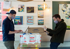 PROVINCETOWN - Rob Anderson, left, and Loic Rossignon co-owners of the Canteen, a popular beachside cafe, prepare grocery orders for delivery and customer pickup on Tuesday, April 21, 2020. Anderson and Rossignon have received over $11,000 in donations to go toward free grocery orders for those who need assistance. 