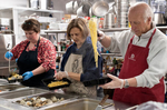 HYANNIS - Faith Family Kitchen volunteers George and Glenna Cappola and Donna Vashon serve up a true New England supper on Friday, April 3, 2020. A donation from SPAT featured Holbrook littlenecks over butter garlic pasta.