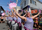 PROVINCETOWN -- 08/18/11-- Jim McHugh of Minneapolis leads the Buzbee Berkley Dance Troupe in their routine on Commercial Street preceding the annual Carnival parade. 